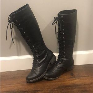 Black combat boots by Rocket Dog